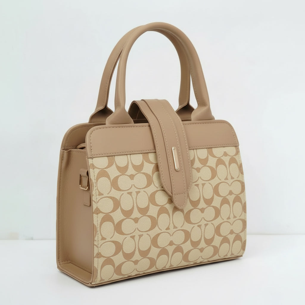 Beige and tan leather handbag with double handles and monogram pattern