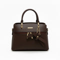 Elegant brown leather handbag with top handles, gold hardware, and a decorative bow charm